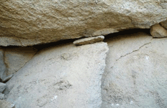 The exposed condition of the lower part of the Seated Buddha Carved on Rock Cliff image